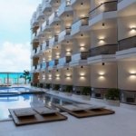 Luxury swimming pool at Storia Del Mare surrounded by elegant architecture and relaxing resort vibes.