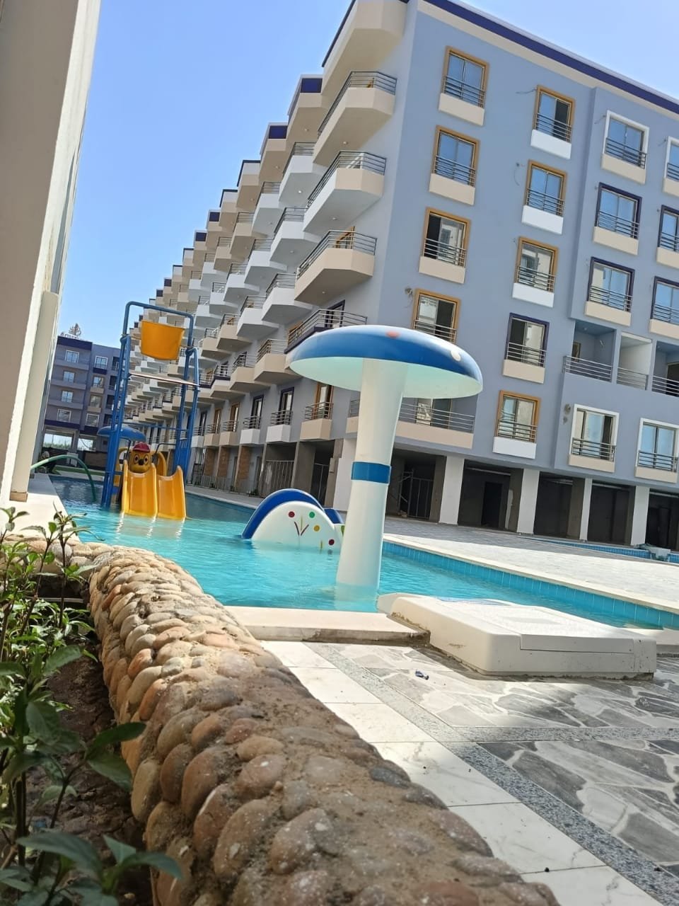 Luxury swimming pool at Lavanda surrounded by elegant architecture and a serene resort atmosphere.