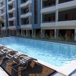 Luxury pool area at Hurghada Heights on the Promenade surrounded by palm trees and sea breeze.