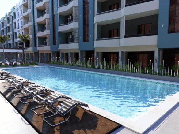 Luxury pool area at Hurghada Heights on the Promenade surrounded by palm trees and sea breeze.