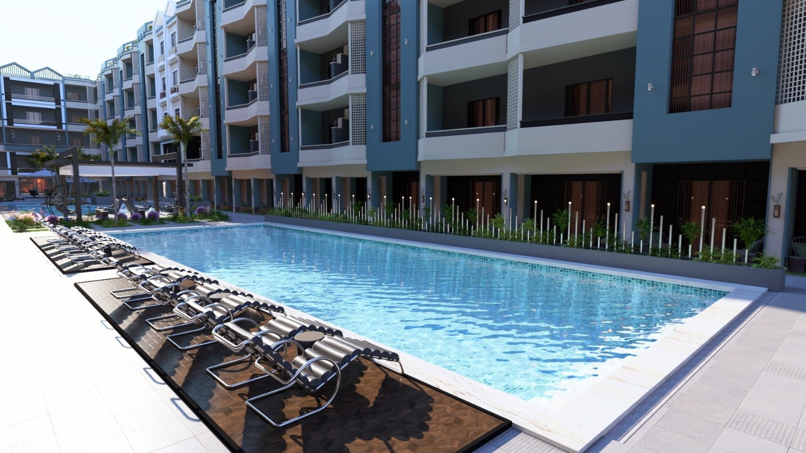 Luxury pool area at Hurghada Heights on the Promenade surrounded by palm trees and sea breeze.