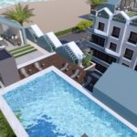 Luxury pool area at Hurghada Heights on the Promenade surrounded by palm trees and sea breeze.