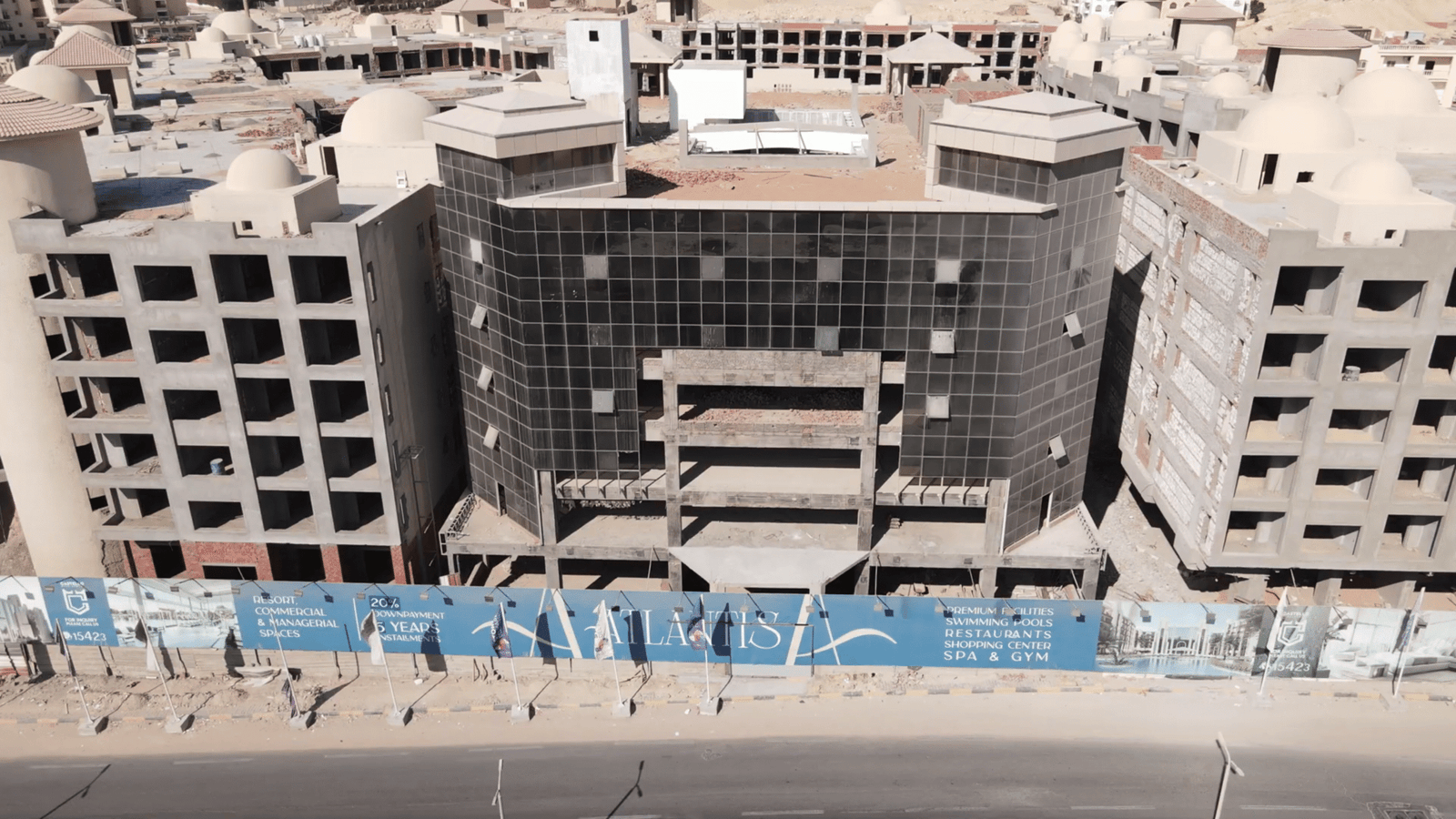 Swimming pools surrounded by palm trees and landscaped gardens at Atlantis Hurghada.