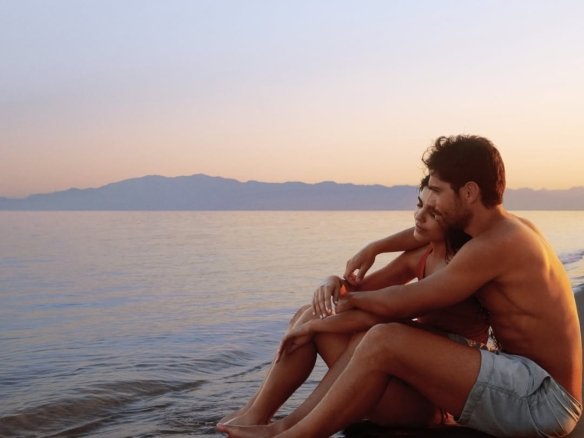 Landscaped gardens and walkways within Ras Soma Residences.