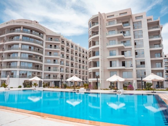 Arabia Area Hurghada coastal view with luxury resorts, residential properties, and Red Sea waterfront.