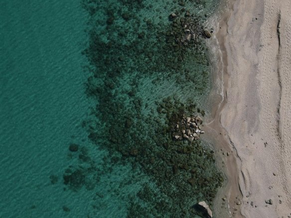 Panoramic view of Hurghada Red Sea coast with luxury resorts and travel guide info.