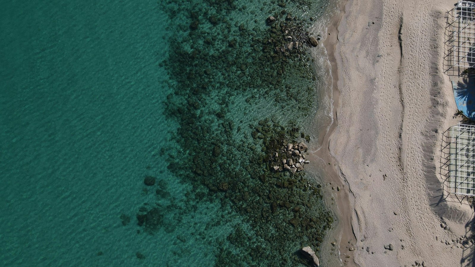 Panoramic view of Hurghada Red Sea coast with luxury resorts and travel guide info.