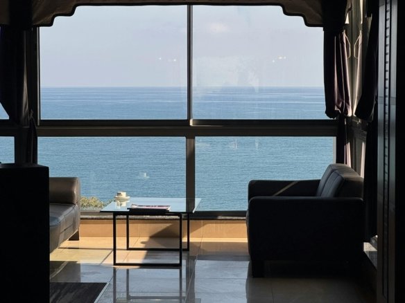 Sea view apartment balcony overlooking the Red Sea during sunset