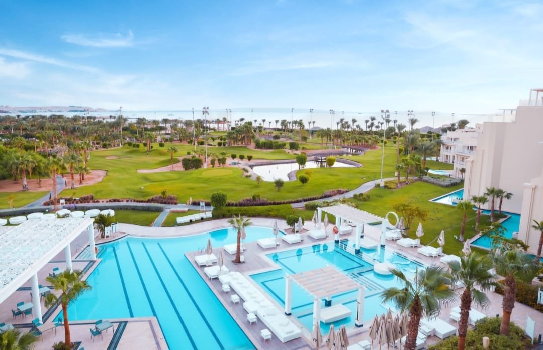 Resort-style rentals property featuring luxury amenities, swimming pools, landscaped gardens, and modern accommodations.