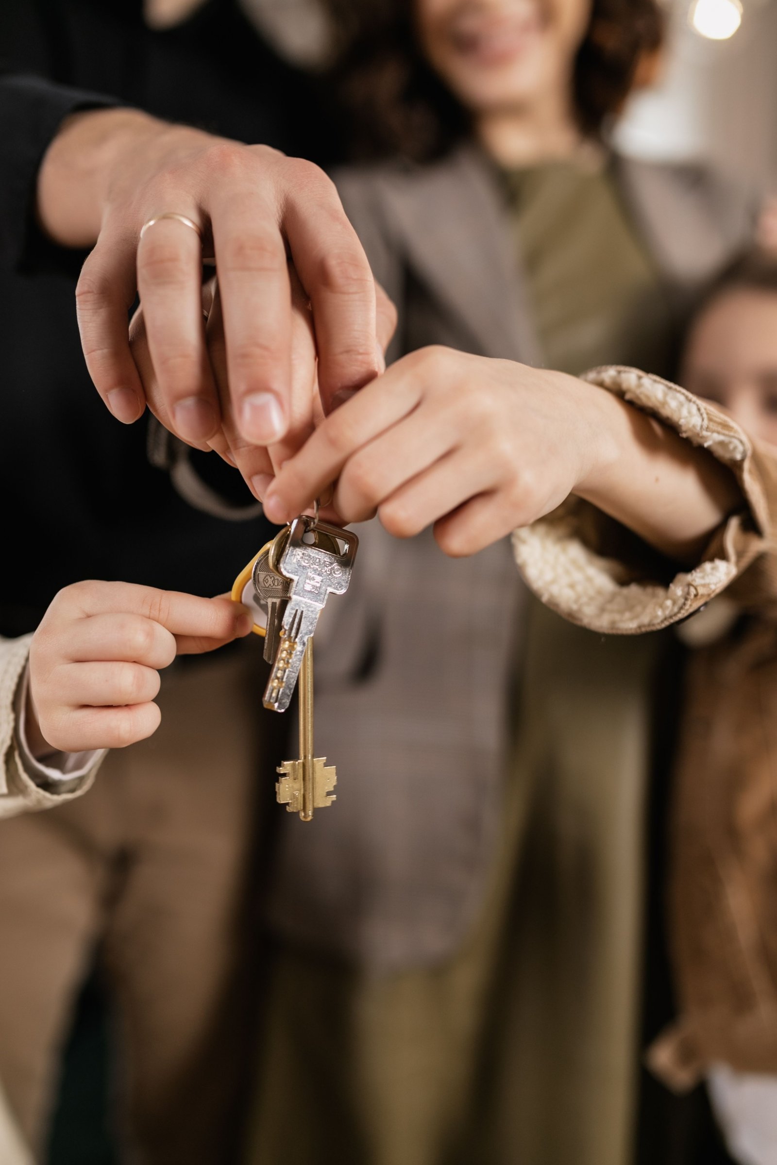 A first-time buyer signing property closing documents with a pen