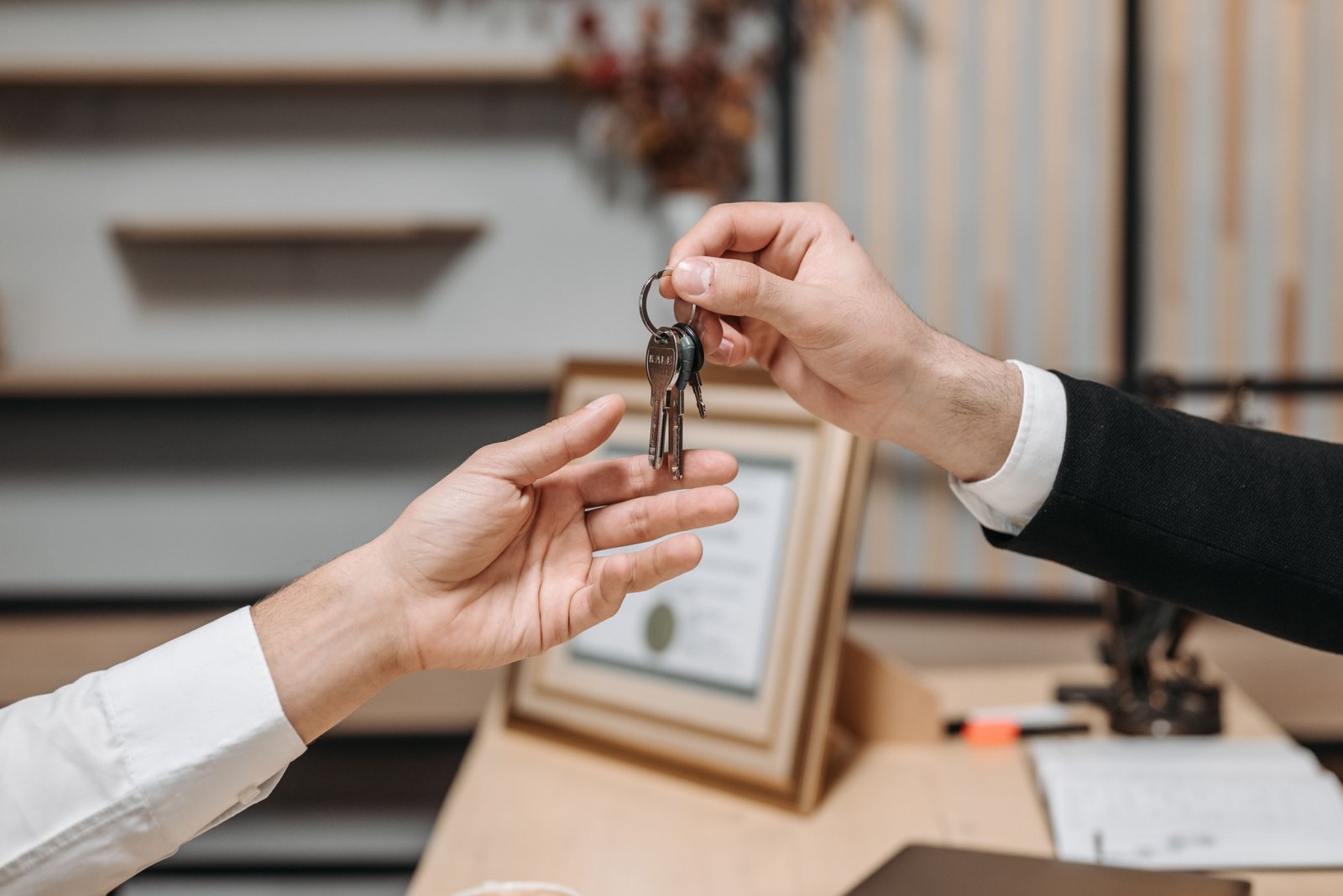 Landlord reviewing rental agreement with new tenants before signing a lease.