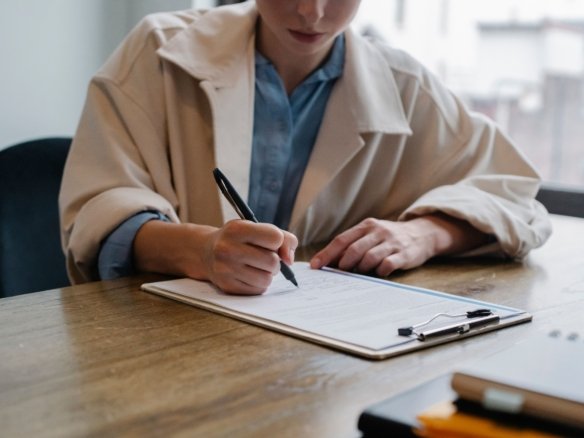 Buying Application form being completed by a homebuyer during the property purchase process