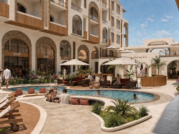 Studio apartment for sale in Amarina Soul Magawish Hurghada Exterior front facade of Amarina Soul Magwish Hurghada featuring modern architecture and commercial units.