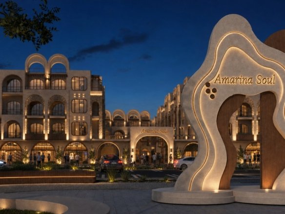 Swimming pool and sun deck area surrounded by pool view units at Amarina Soul Magwish Hurghada.