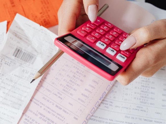 Homebuyer reviewing unexpected costs and additional expenses before purchasing a property.