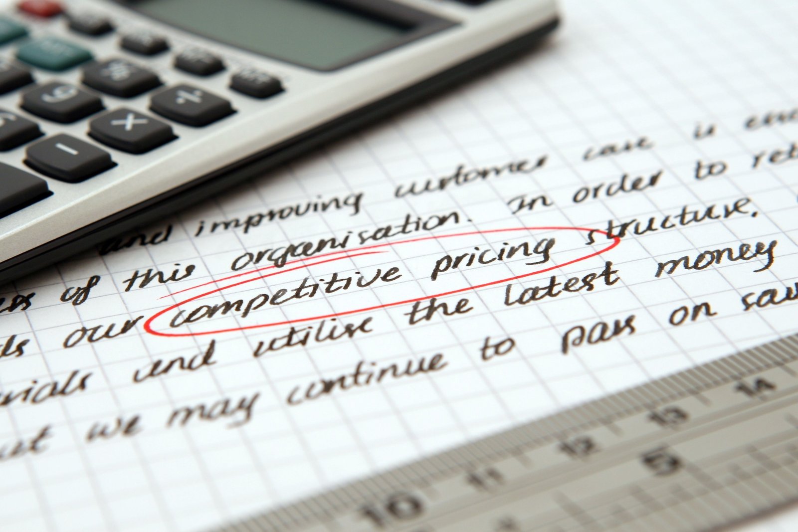 Pricing discussion between a business consultant and a client reviewing service costs and value.