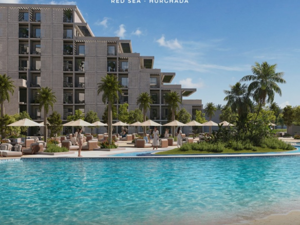 ALDAU Penta contemporary residential buildings framing a central resort pool with sun loungers in Hurghada