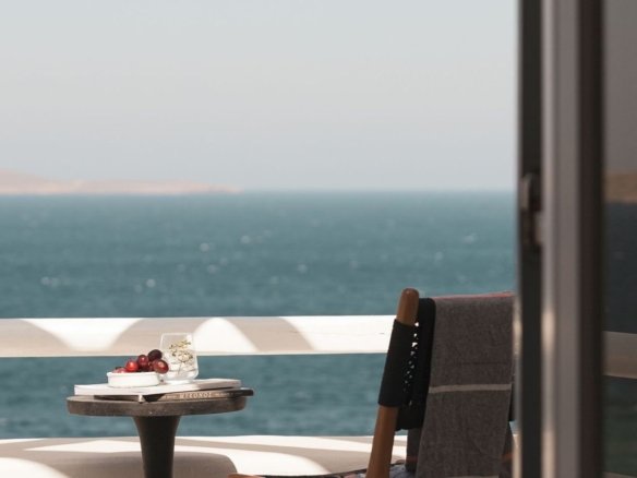 how to buy property in Hurghada from abroad Expat investor reviewing virtual property documents on a laptop with a view of Red Sea apartments in Hurghada by Knight Properties