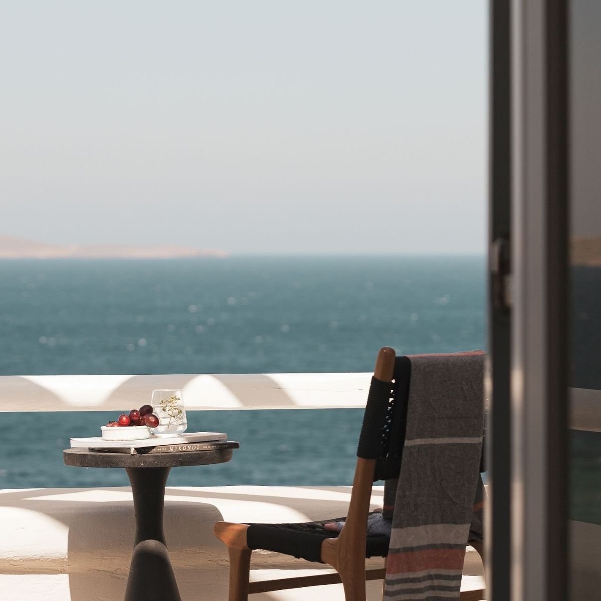 how to buy property in Hurghada from abroad Expat investor reviewing virtual property documents on a laptop with a view of Red Sea apartments in Hurghada by Knight Properties