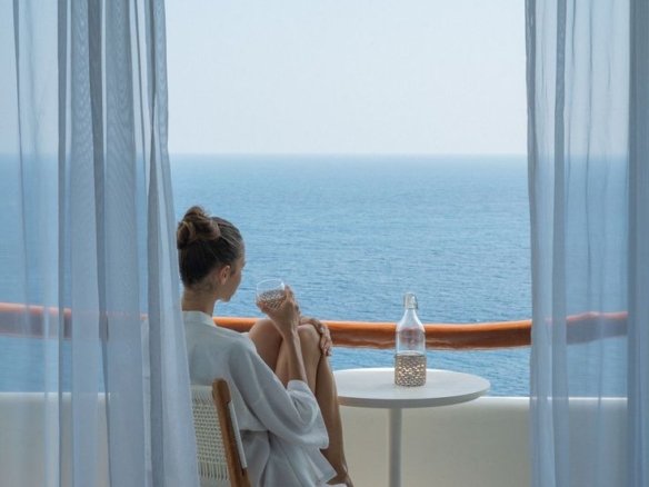 how to find bargain apartments for sale in Hurghada Modern residential apartment building balcony overlooking the Red Sea coast in Hurghada with Knight Properties logo.
