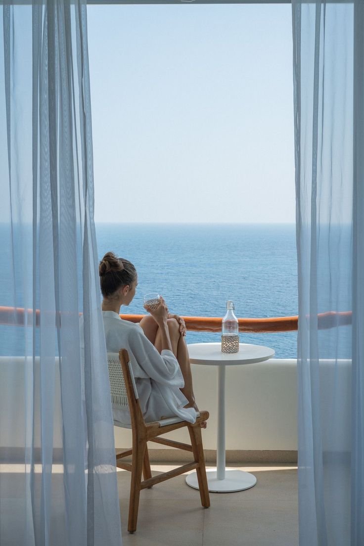 how to find bargain apartments for sale in Hurghada Modern residential apartment building balcony overlooking the Red Sea coast in Hurghada with Knight Properties logo.